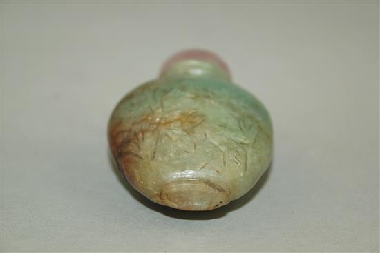 A Chinese pale green and russet jadeite snuff bottle, 1880-1930, 5.9cm